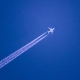 Airplane with jet trail